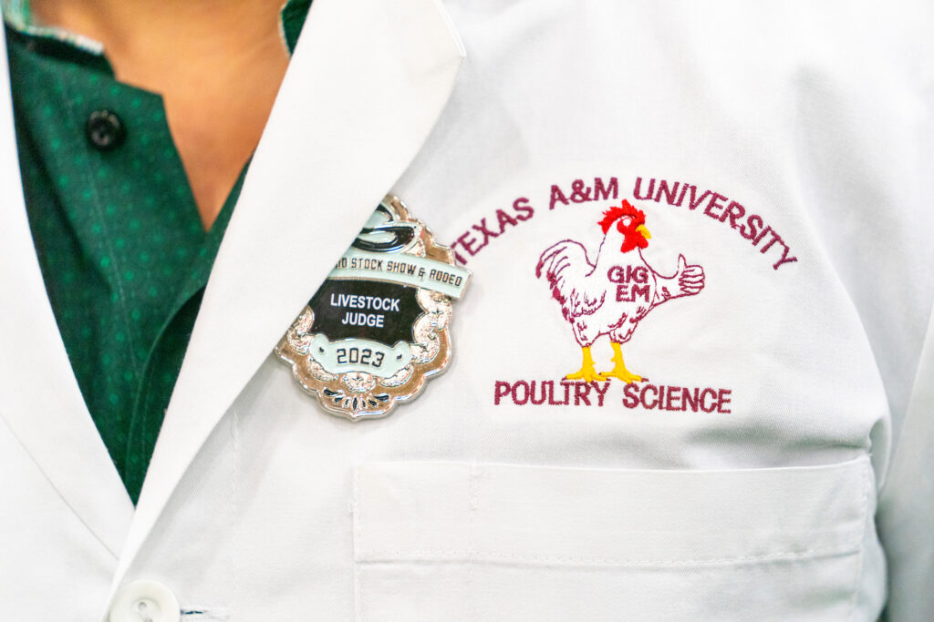 The Texas A&M University Poultry Science logo on a persons jacket.